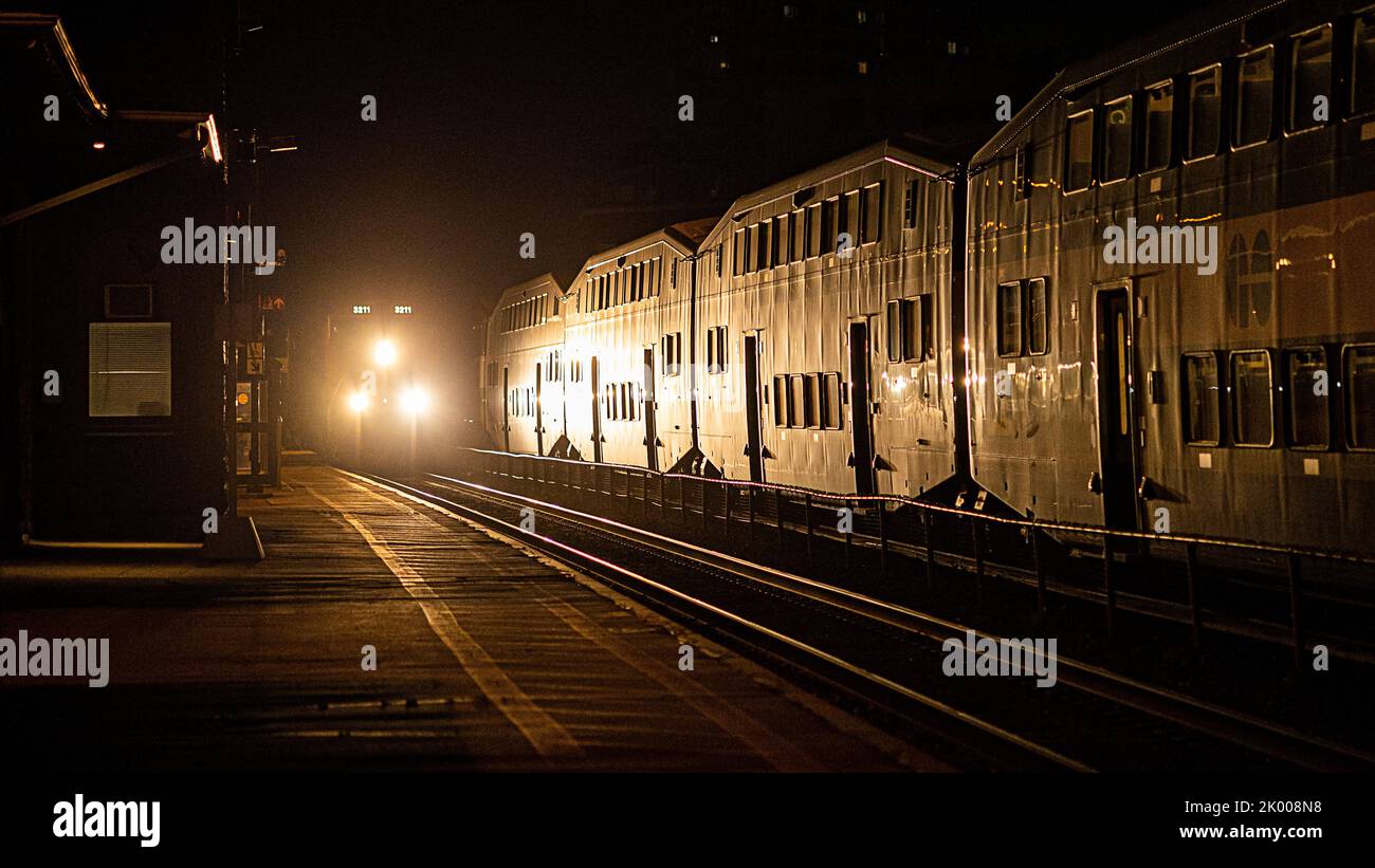 the night train passing the station Stock Photo