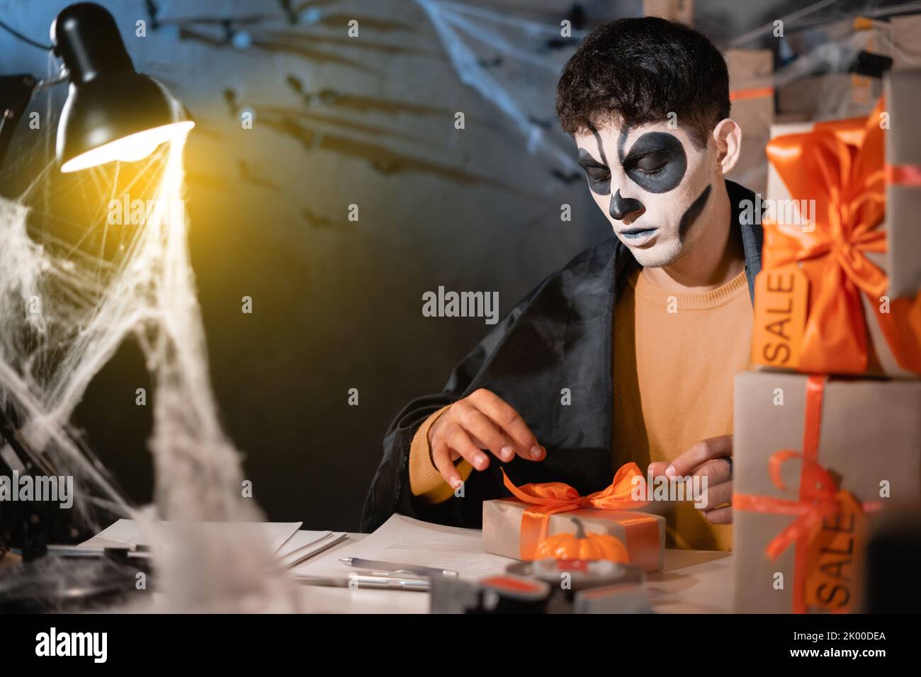 Successful small business owner, freelance makeup artist skeleton preparing package for delivery to customers, small and medium business entrepreneurs Stock Photo