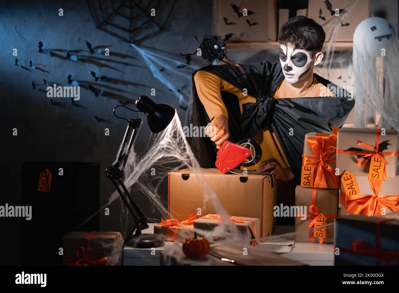 Drop shipping business owner wears white clay skull, professional makeup in home office. Seal