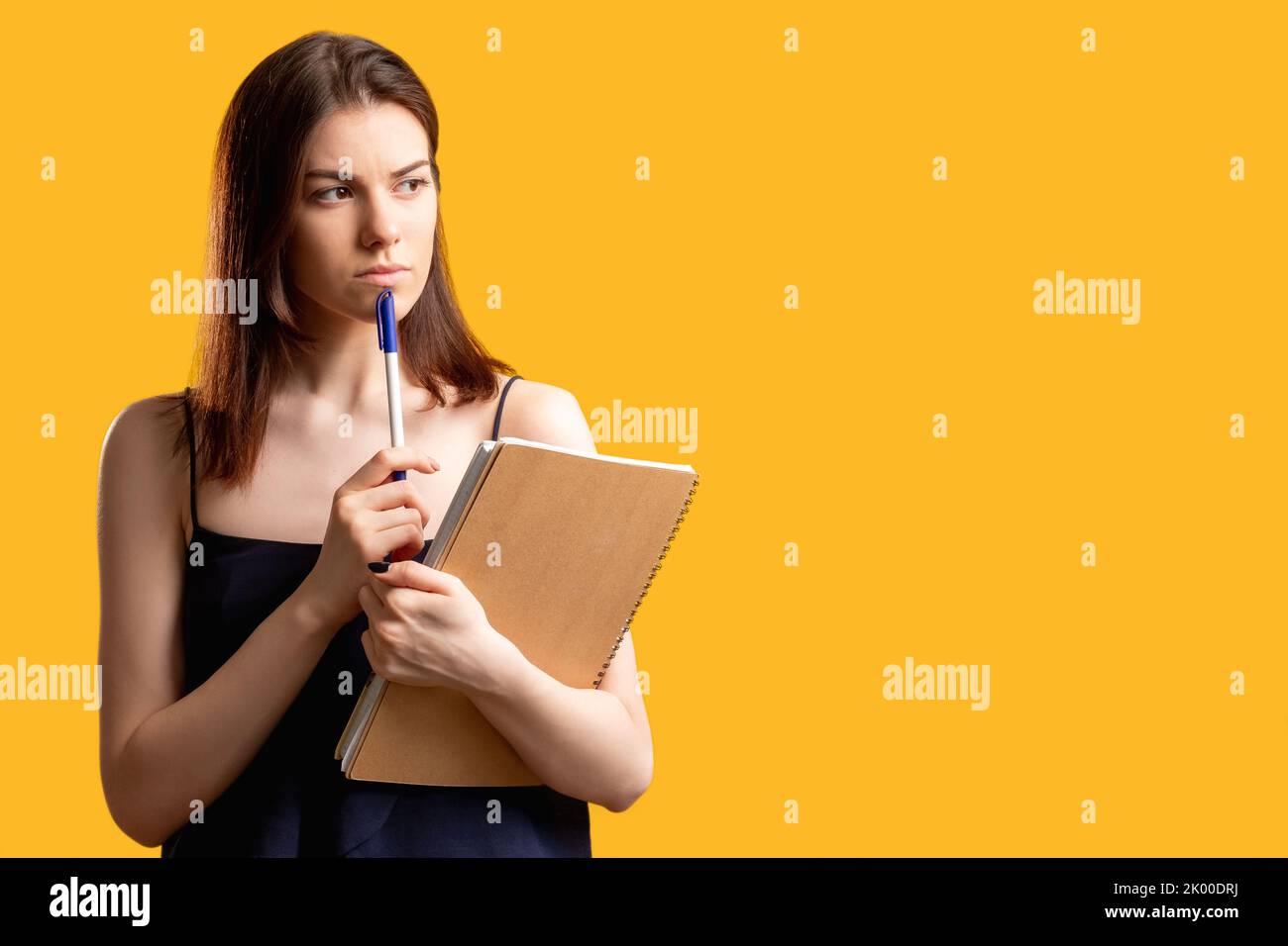 puzzled face payments planning thoughtful woman Stock Photo