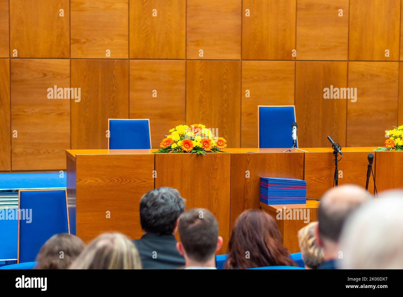 BRNO, CZECH REPUBLIC - 12.7.2019: Graduation ceremony at Masaryk University in Brno. The diploma certificate is prepared on the table. Families of the Stock Photo