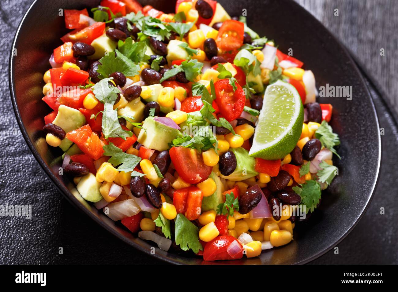 cowboy bean salad, texas caviar with black bean, tomatoes, avocado, red