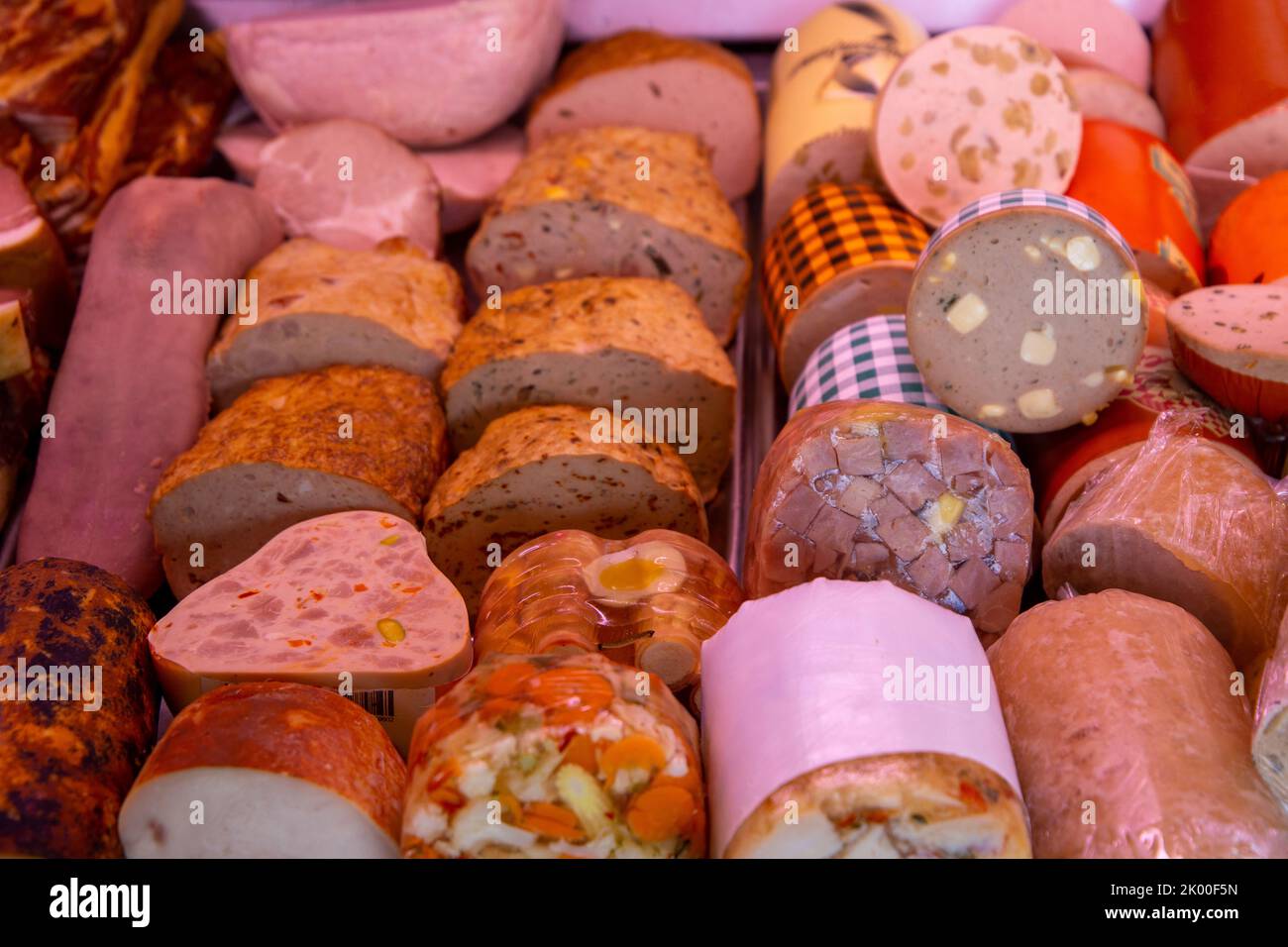 Sausage counter in a butchers shop Stock Photo