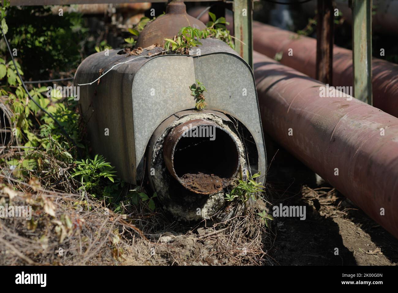 Details with old and rusty pipelines at a Romanian abandoned power plant. Stock Photo
