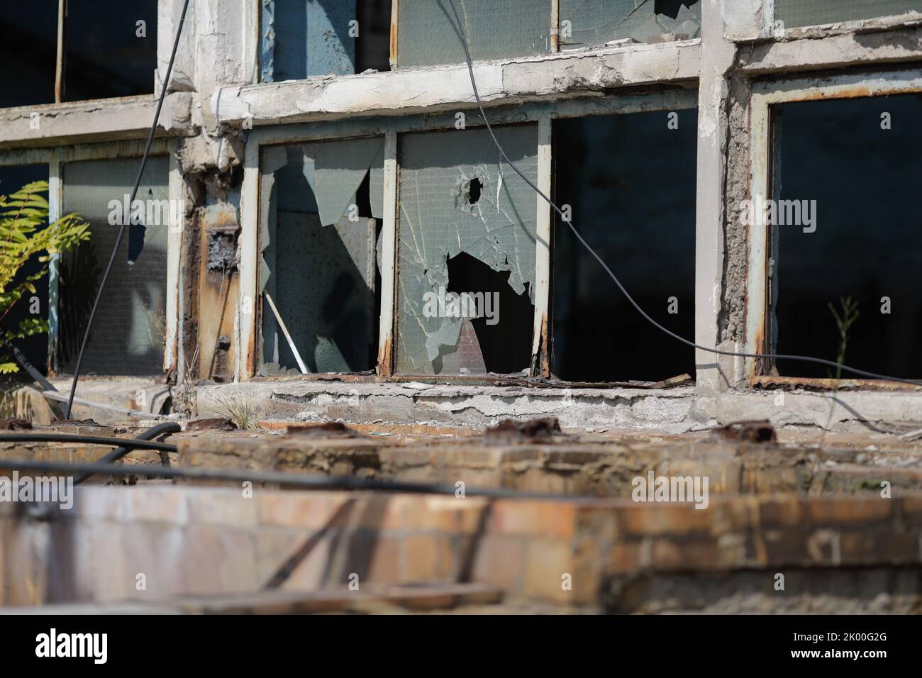 Broken walls and windows in an abandoned industrial building Stock ...