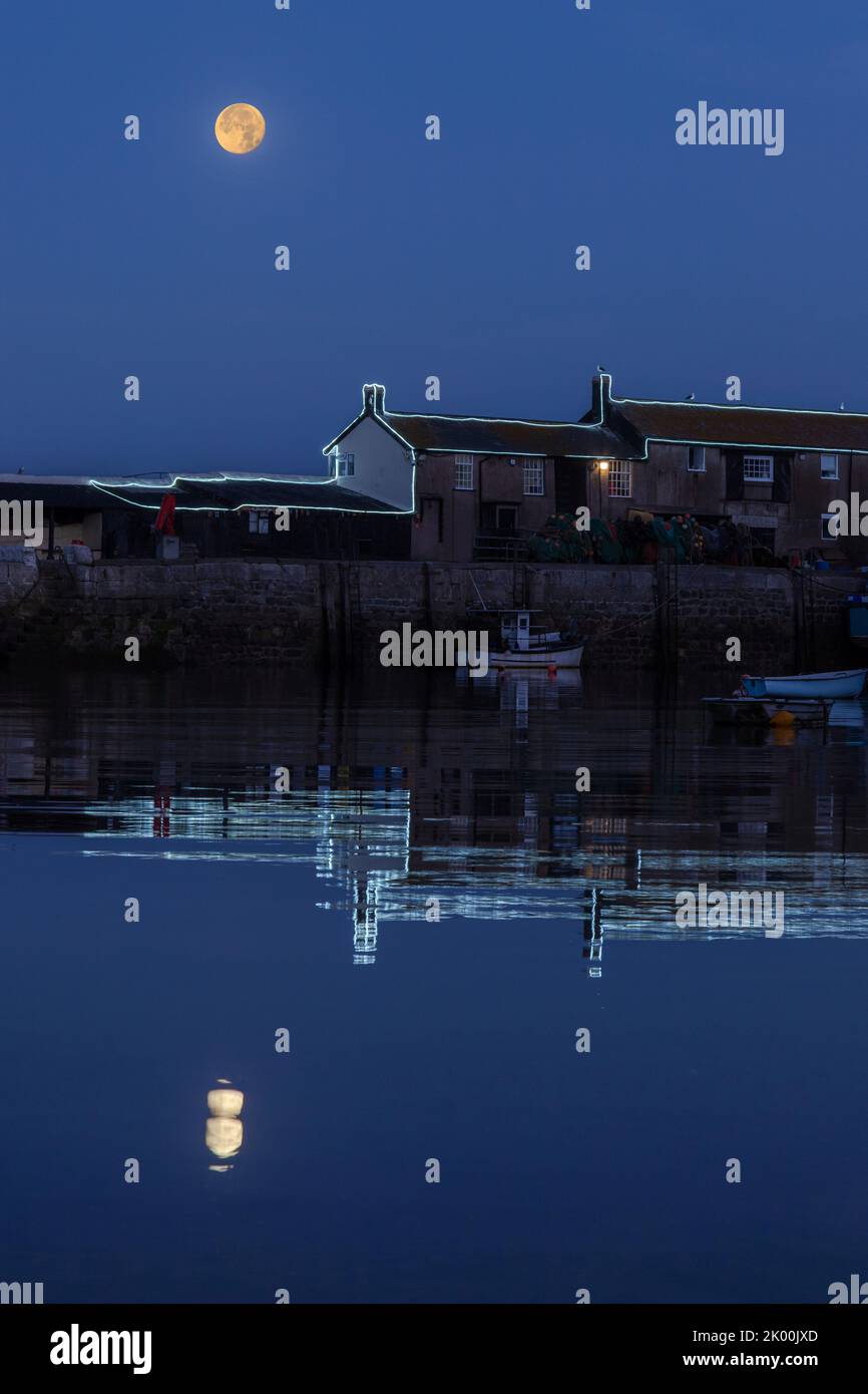 Iconic Cobb harbour in Lyme Regis, Dorset at night Stock Photo