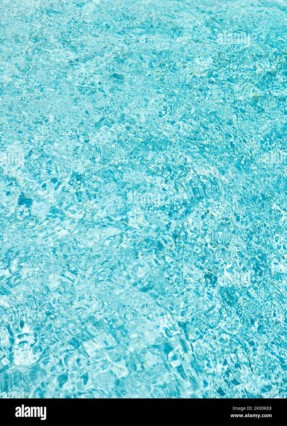 turquoise color background of swimming pool water with ripples in