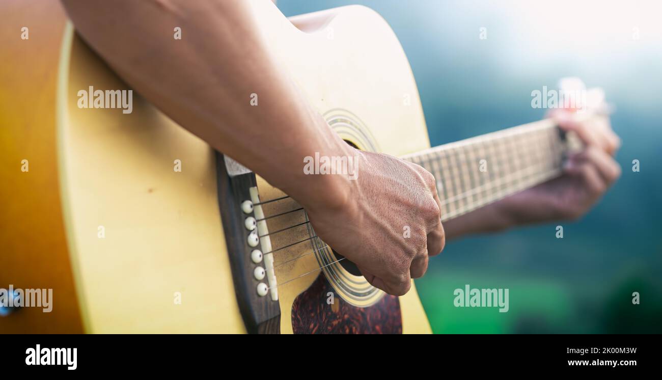 Man playing guitar praise and worship to god, Close up and focus at hand. Stock Photo