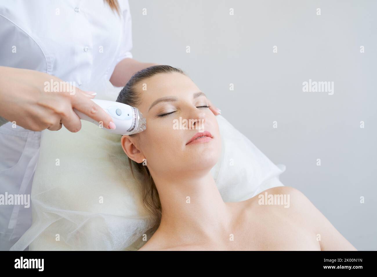 View women's spa procedure. Electrical stimulation facial skin care