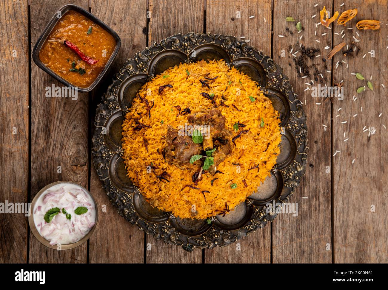 An Indian dish made with highly seasoned rice and spices marinated meat