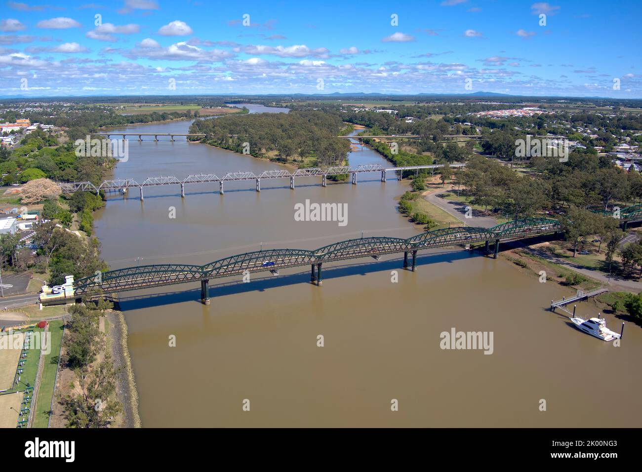 Aerial of the Burnett Ttraffic Bridge and Rail Bridge crossing the Burnett River at Bundaberg Queensland Australia Stock Photo
