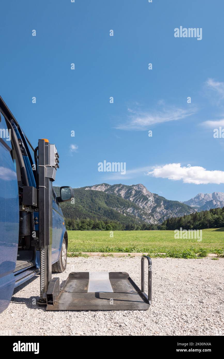 Accessible car with wheelchair lift ramp for person with disability