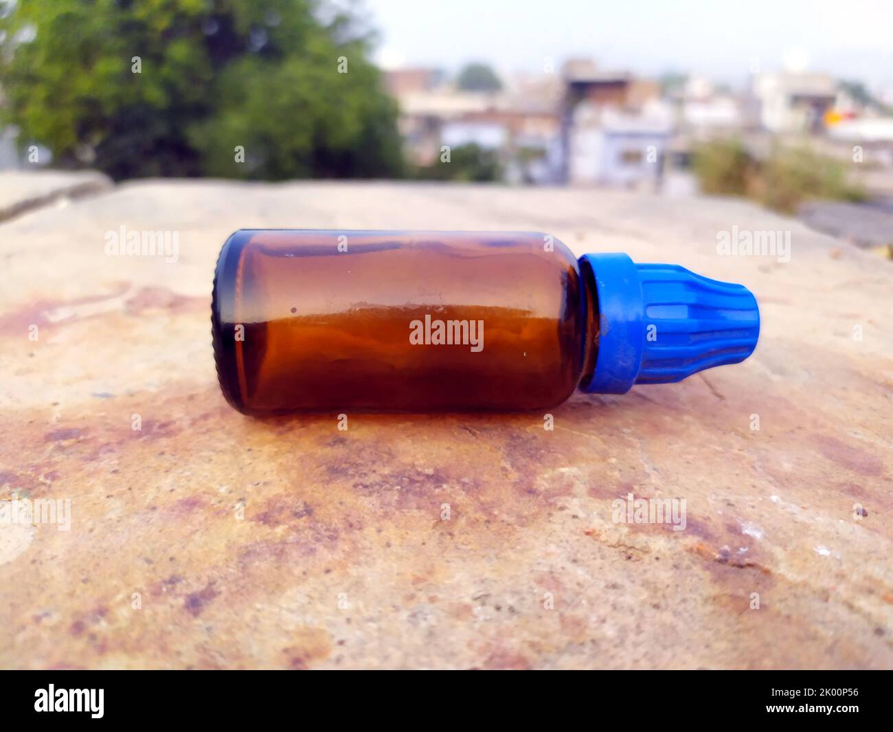 brown glass bottle put on the road Stock Photo Alamy