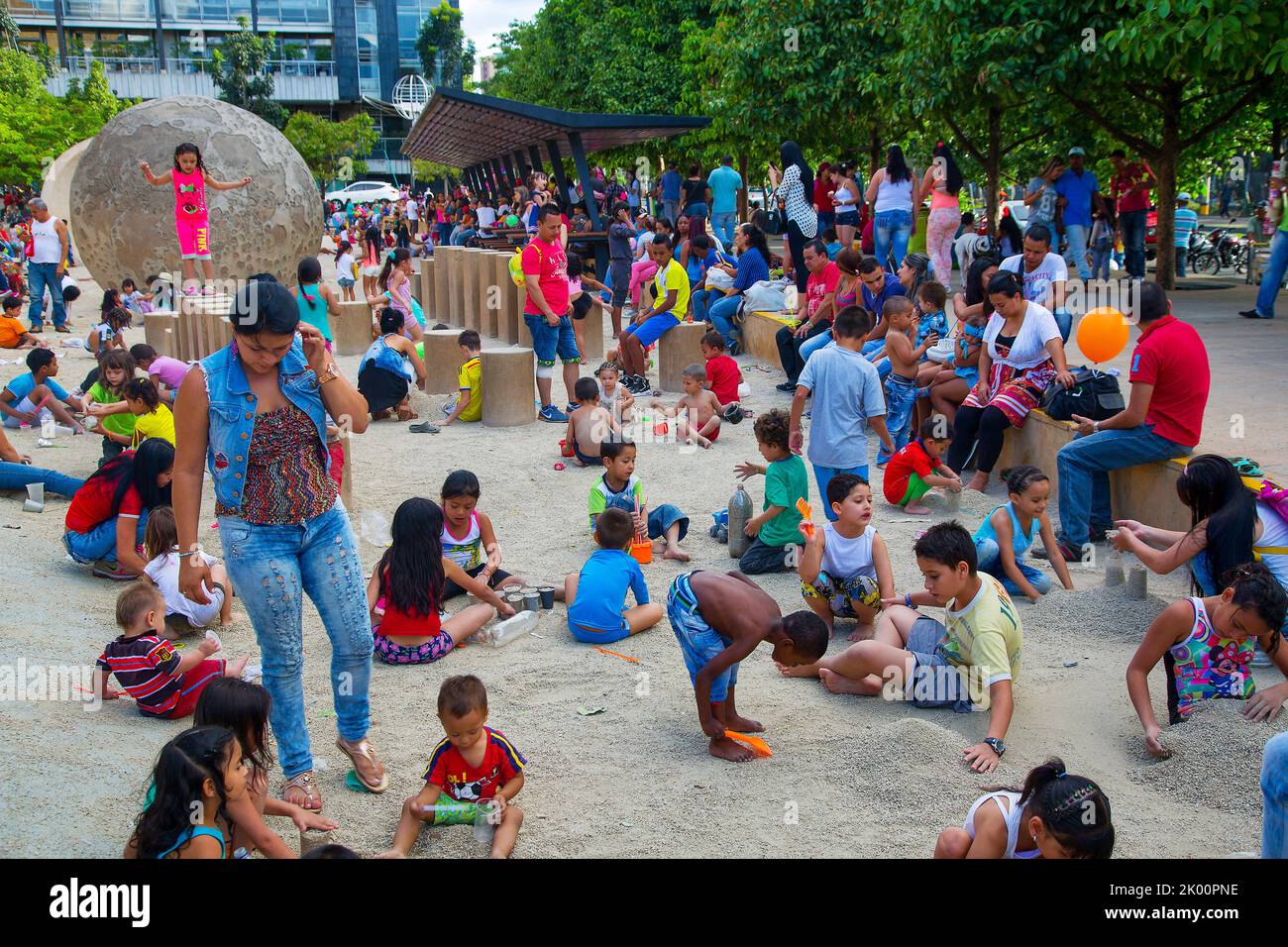 Colombia,Medellin, near Universidad metro station people can relax on the square next to Explora Parque with activities for children lwith sand and wa Stock Photo