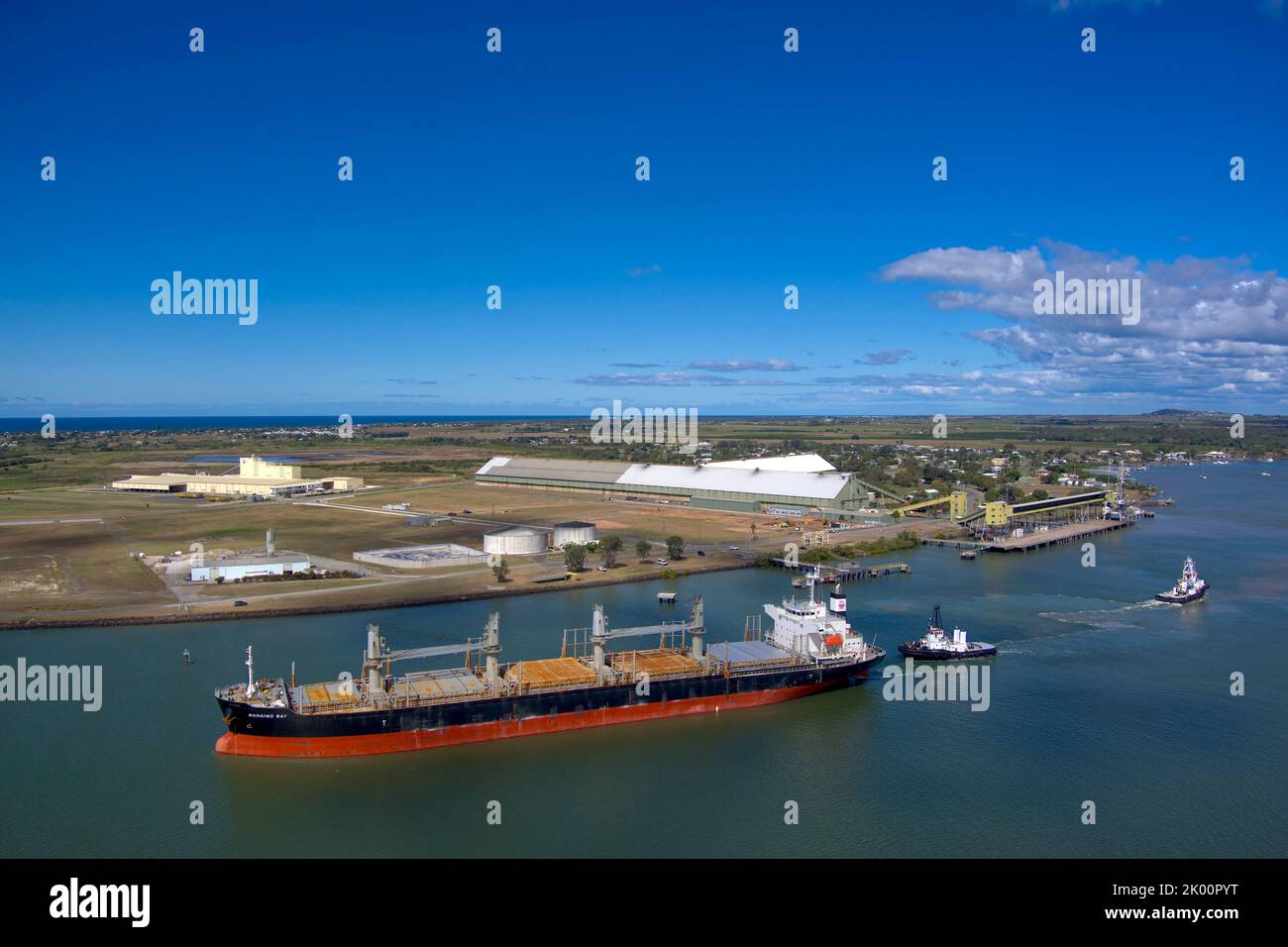 Aerial of bulk carrier Nanaimo Bay departing from the Sugar Terminal on the Burnett River Port Bundaberg Queensland Australia after unloading gypsum Stock Photo
