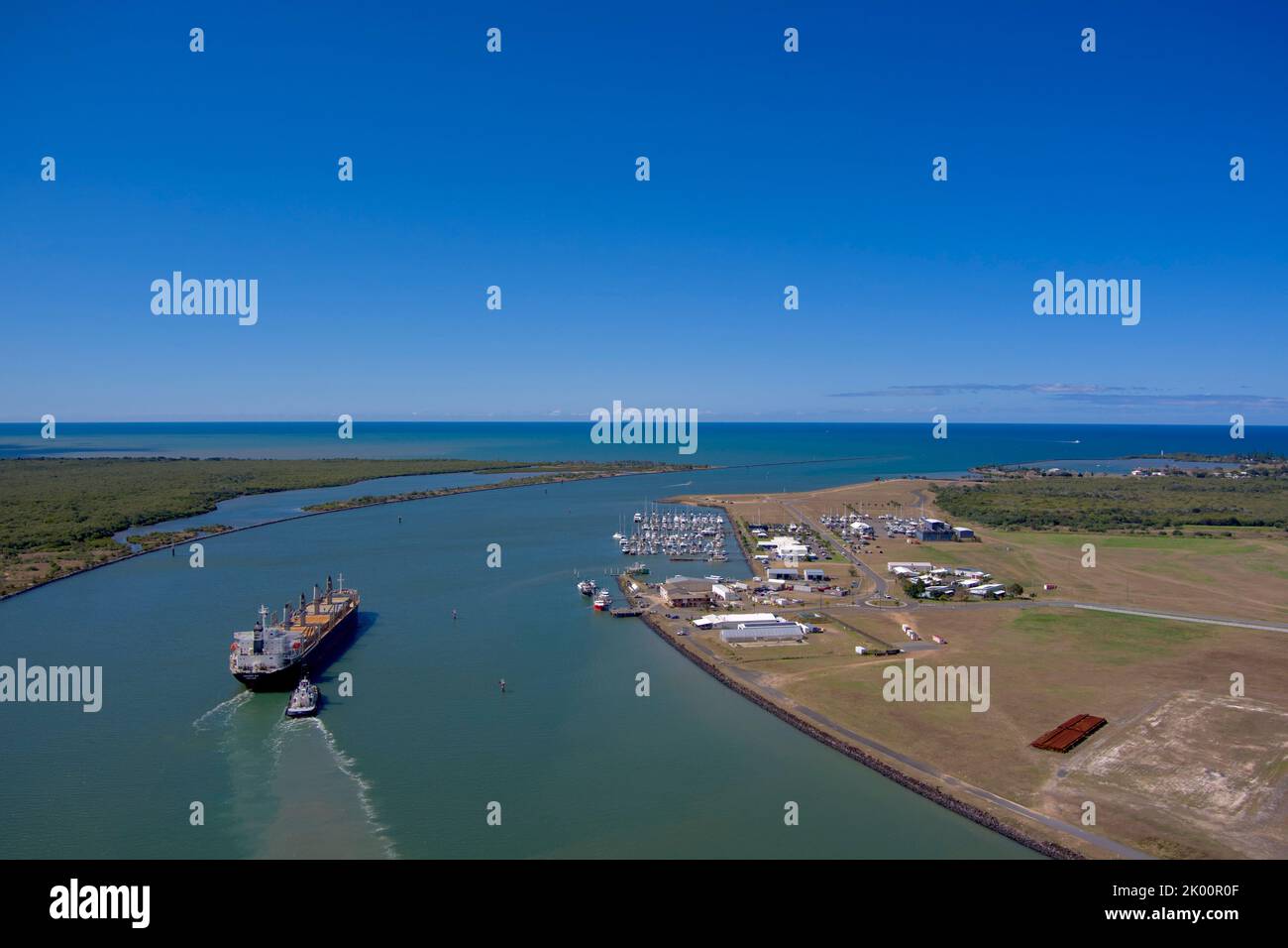 Aerial of bulk carrier Nanaimo Bay departing Port Bundaberg on the Burnett River Queensland Australia Stock Photo