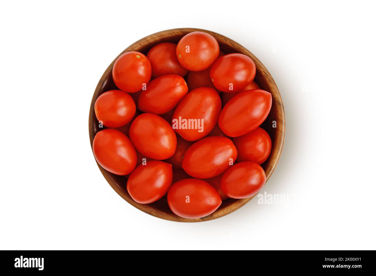 Datterini tomatoes in wooden bowl on white background Stock Photo