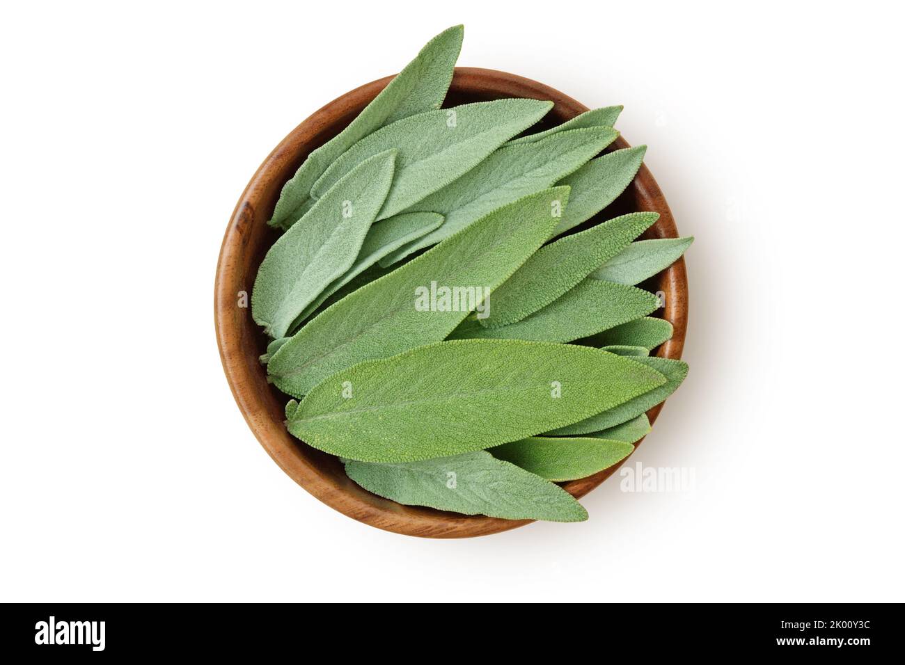 Fresh sage leaves in wooden bowl on white background Stock Photo