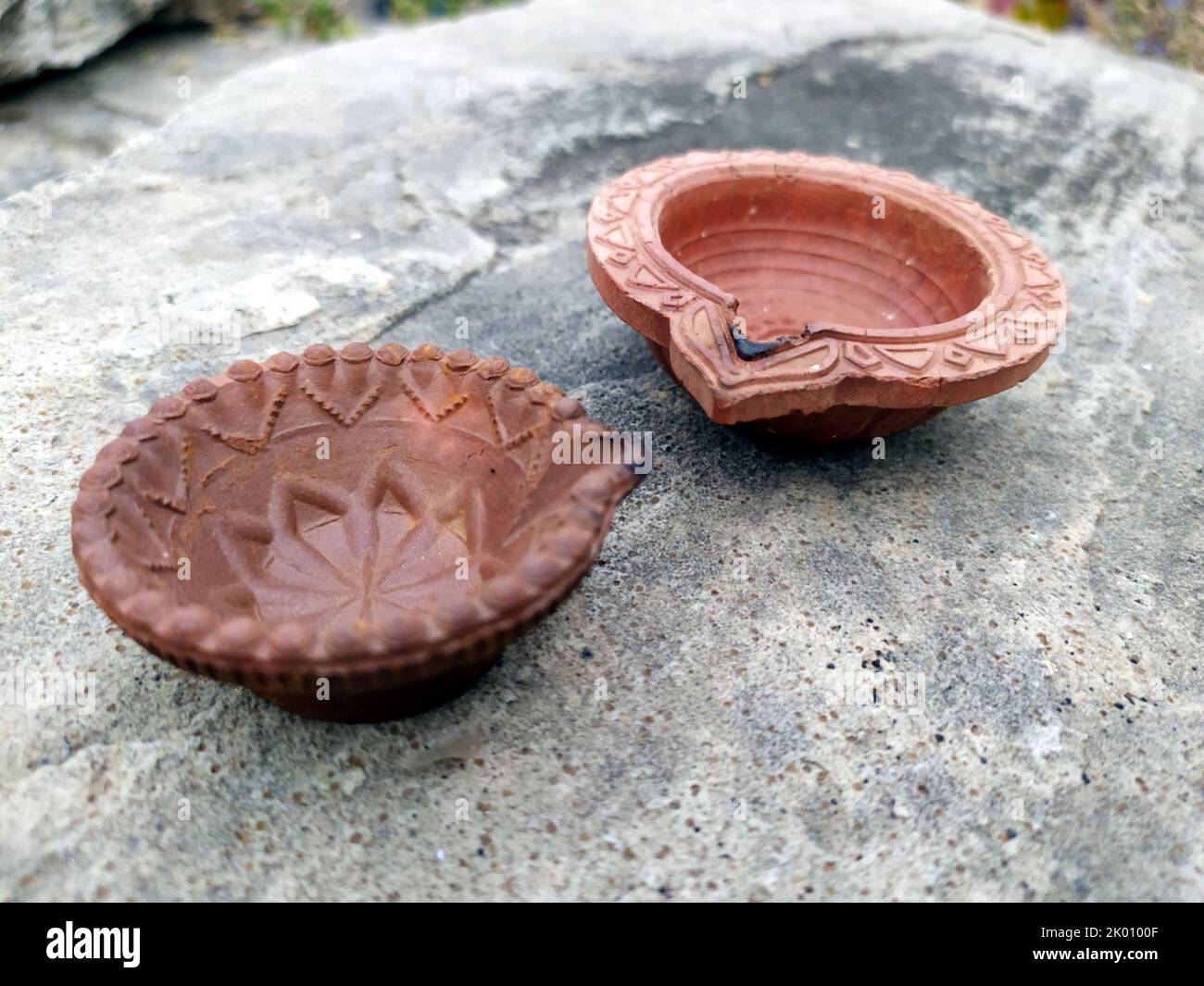 oil clay lamp put on a big stone Stock Photo