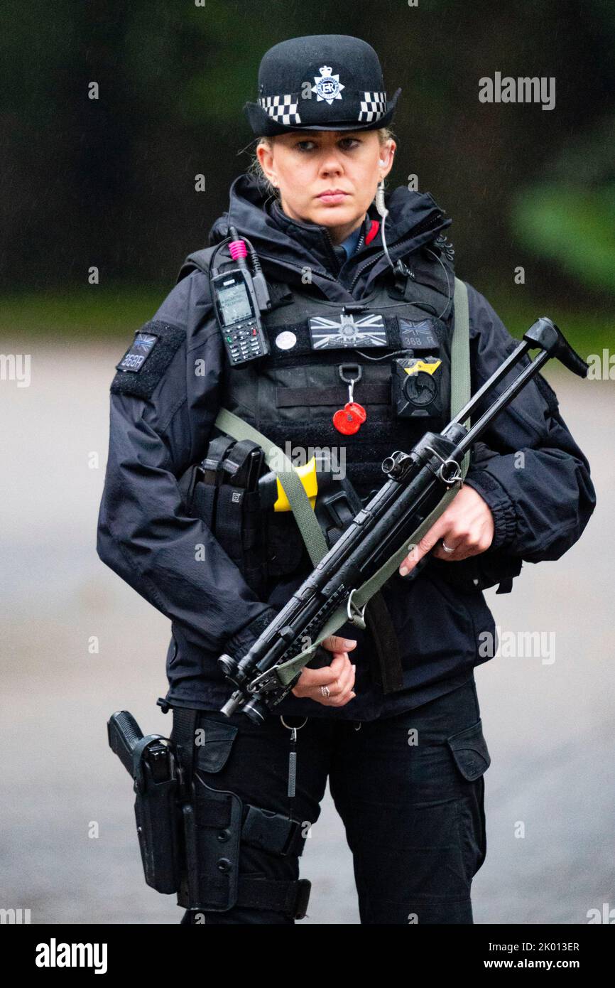 Balmoral, Scotland, UK. 9th September 2022. Armed policewoman at the entrance gates to Balmoral Castle following news of death of HRH Queen Elizabeth II yesterday.  Iain Masterton/Alamy Live News Stock Photo