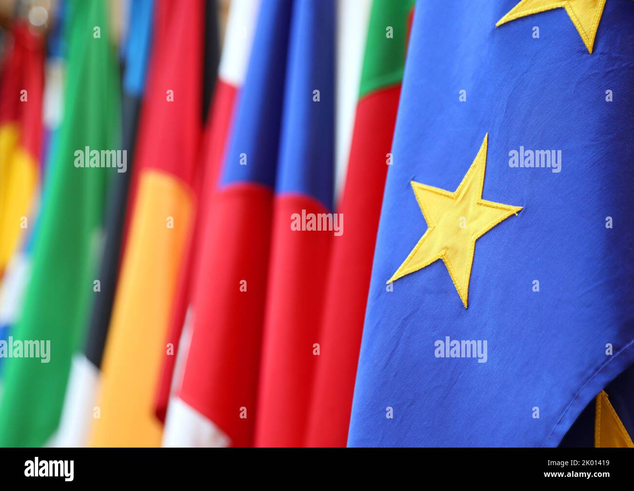 yellow star on a blue background of the flag of the European Union and ...