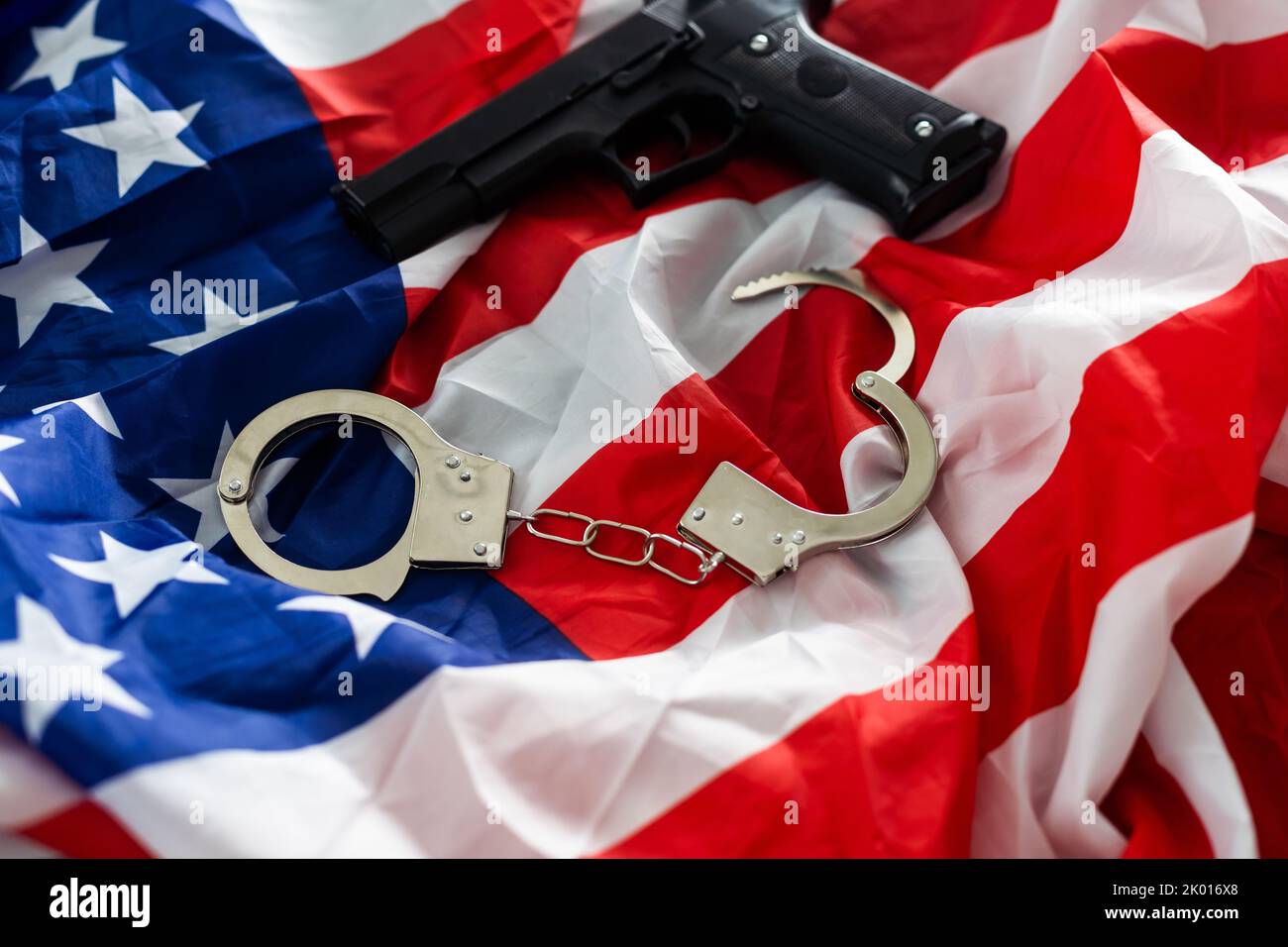 History. handcuffs and gun USA flag Stock Photo Alamy