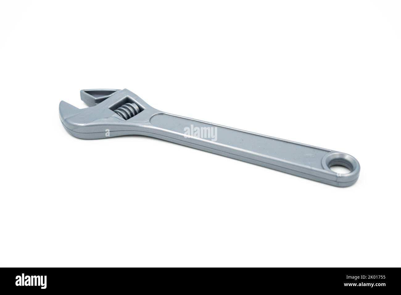 Plastic children's toy gray wrench with adjustable head Stock Photo