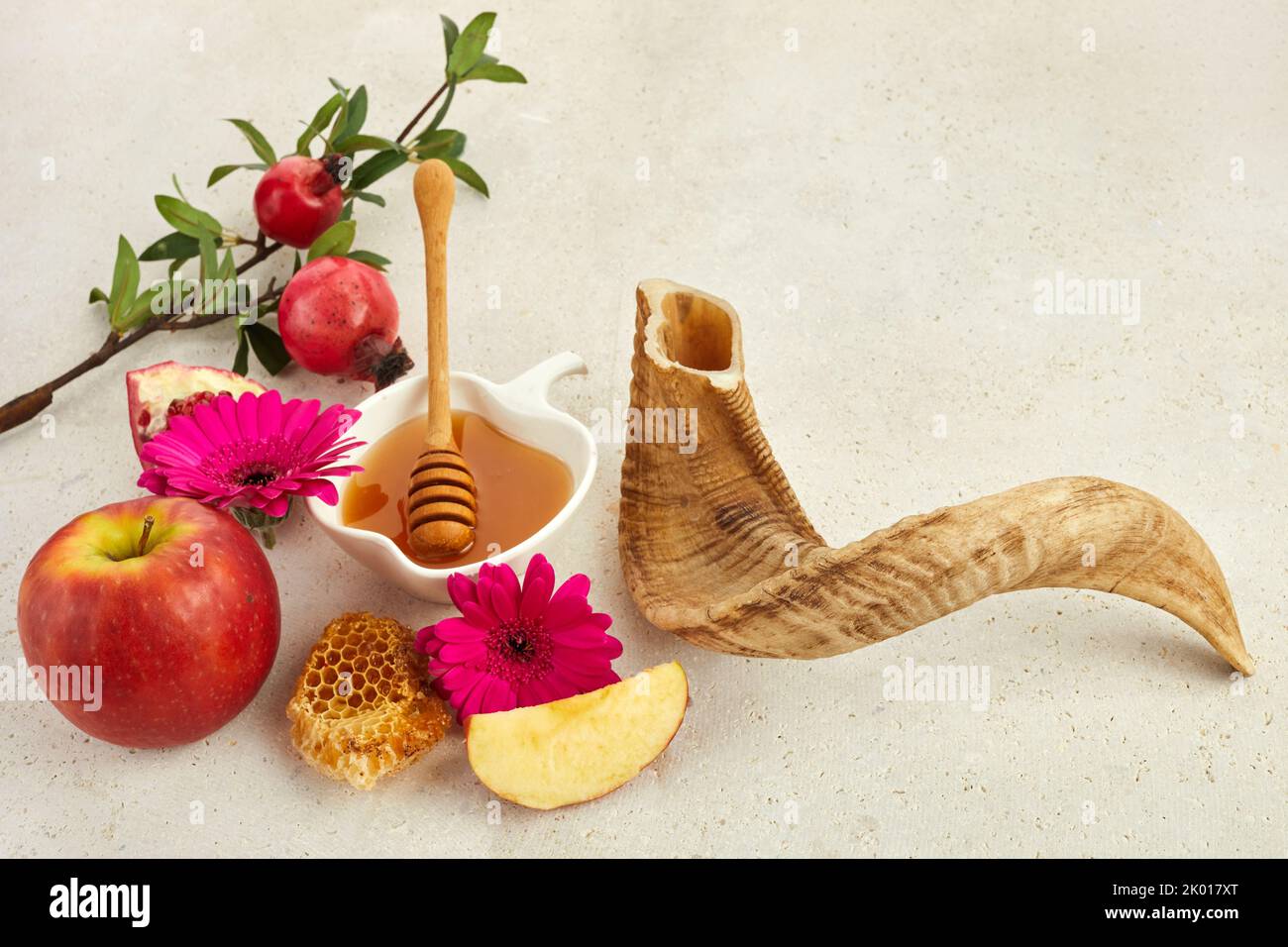Rosh hashanah, jewish New Year holiday concept. Pomegranate, apples and honey traditional products for celebration. Stock Photo