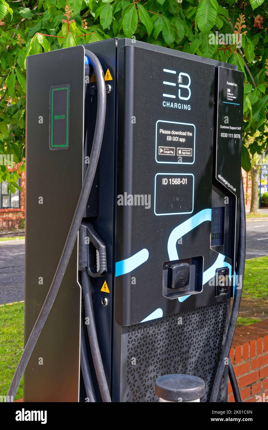 modern hi tech electric car charging point in car park, lancashire,england,uk Stock Photo