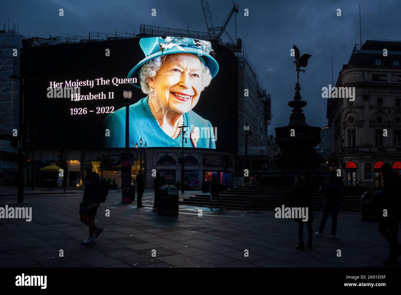 London, UK.  9 September 2022.  A tribute to the Queen is seen at dawn on the digital screens at Piccadilly Circus outside Buckingham Palace.  The day before, it was announced that Queen Elizabeth II, the longest-reigning monarch in British history, had died at the age of 96 in Balmoral, Scotland.  Her son, to be now known as King Charles III, will succeed her.  Credit: Stephen Chung / Alamy Live News Stock Photo