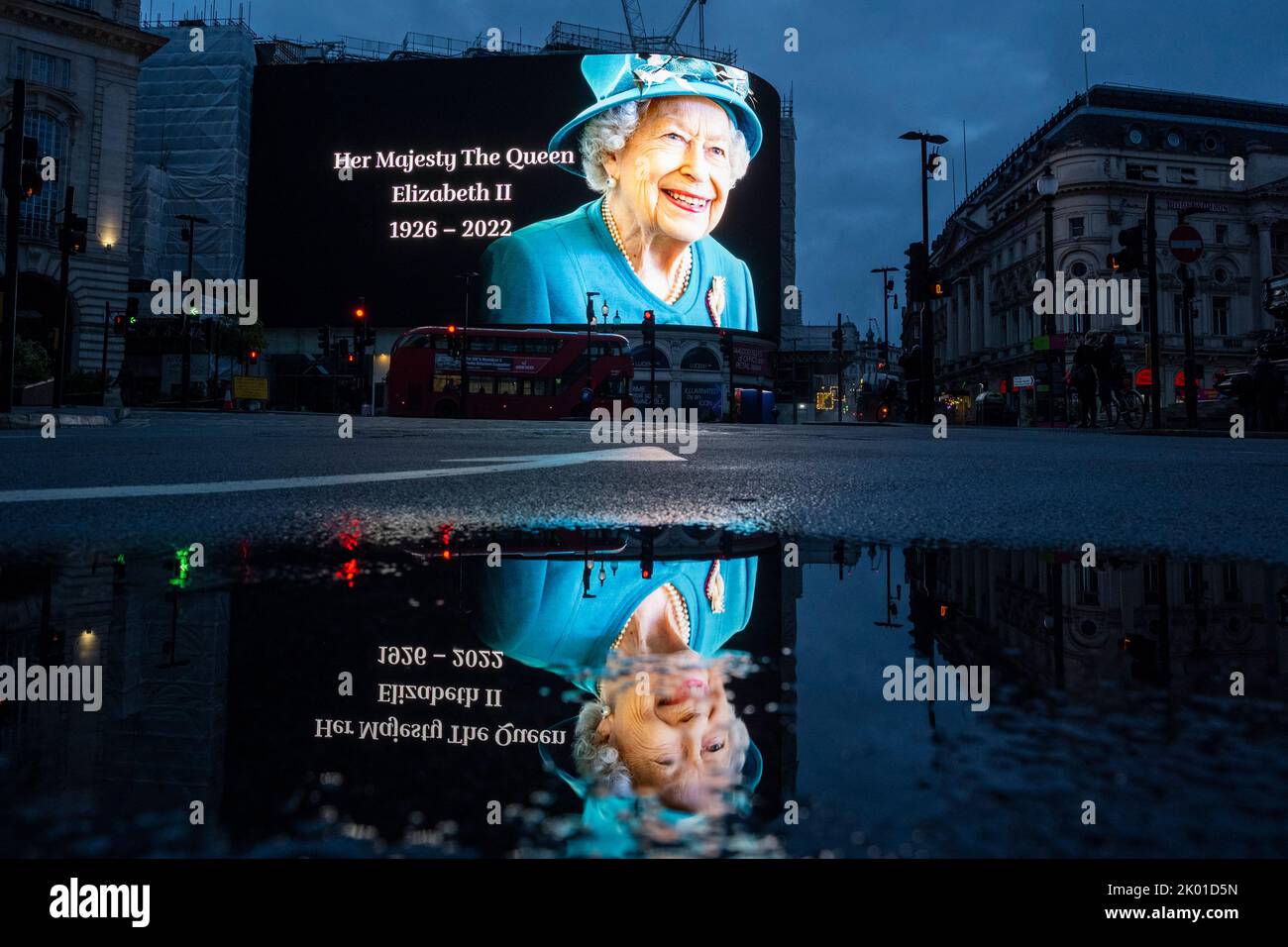 London, UK.  9 September 2022.  A tribute to the Queen is seen at dawn on the digital screens at Piccadilly Circus outside Buckingham Palace.  The day before, it was announced that Queen Elizabeth II, the longest-reigning monarch in British history, had died at the age of 96 in Balmoral, Scotland.  Her son, to be now known as King Charles III, will succeed her.  Credit: Stephen Chung / Alamy Live News Stock Photo