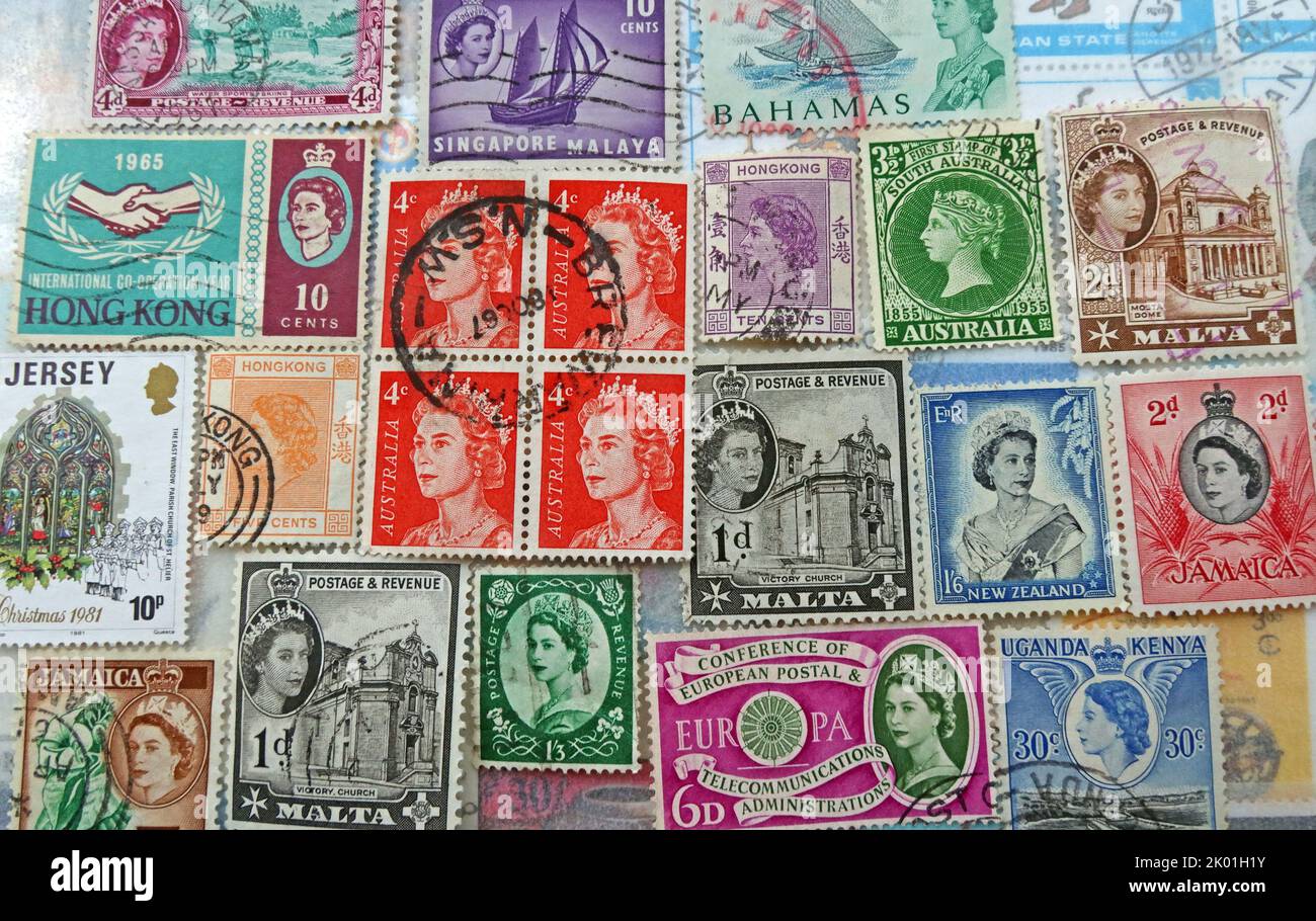 Commonwealth & British Empire stamps from many nations and countries bearing queen Elizabeth's head over the years ER Stock Photo