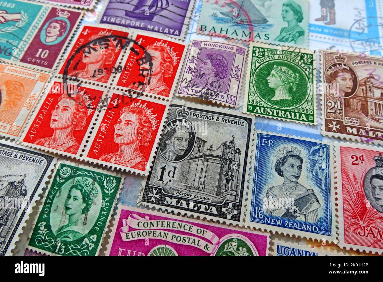 Commonwealth & British Empire stamps from many nations and countries bearing queen Elizabeths head over the years ER Stock Photo