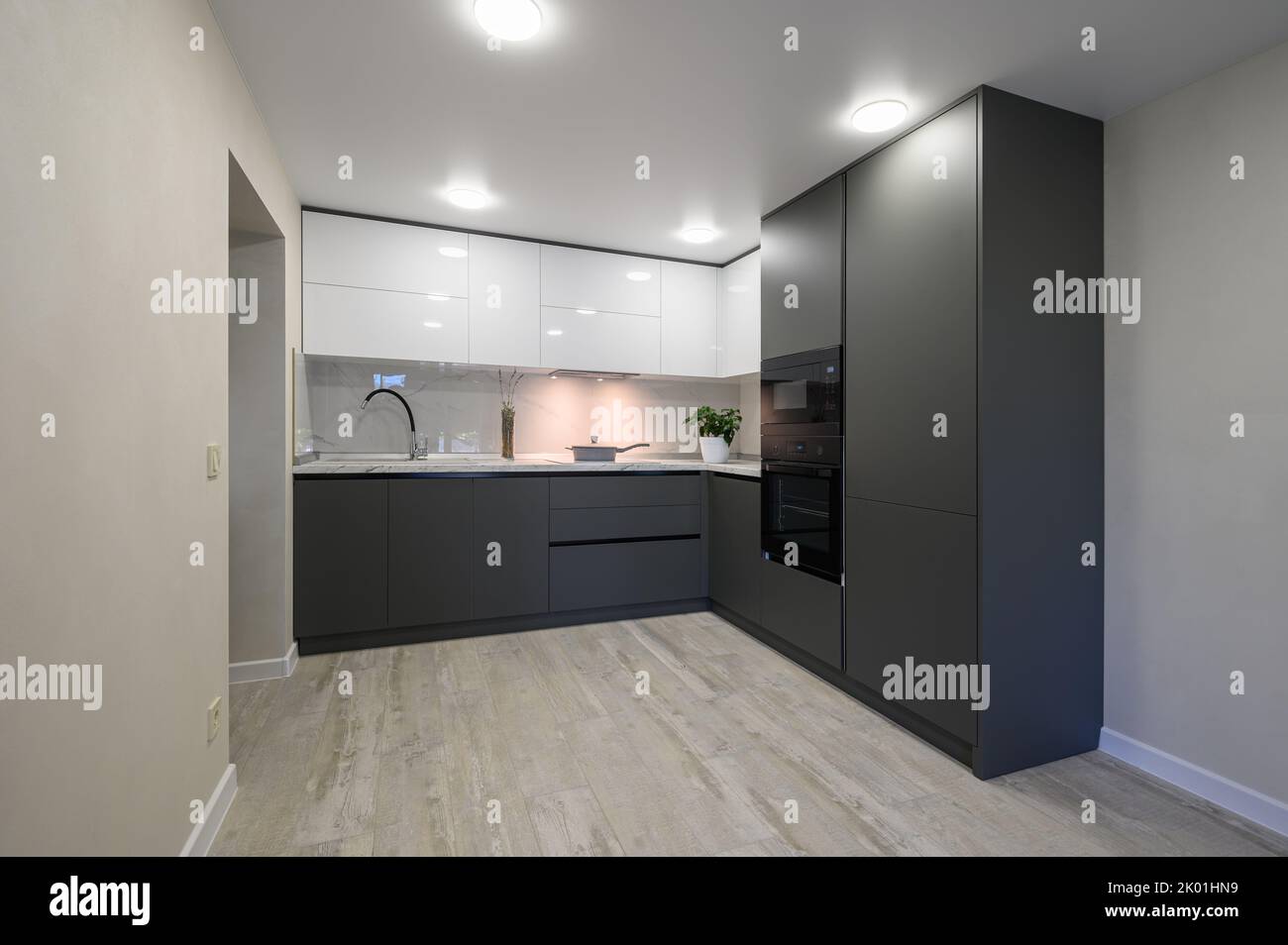 Modern simple trendy dark grey and white kitchen Stock Photo