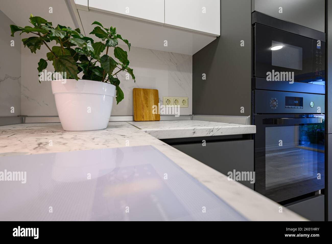 Marble worktop of modern white and dark grey kitchen Stock Photo