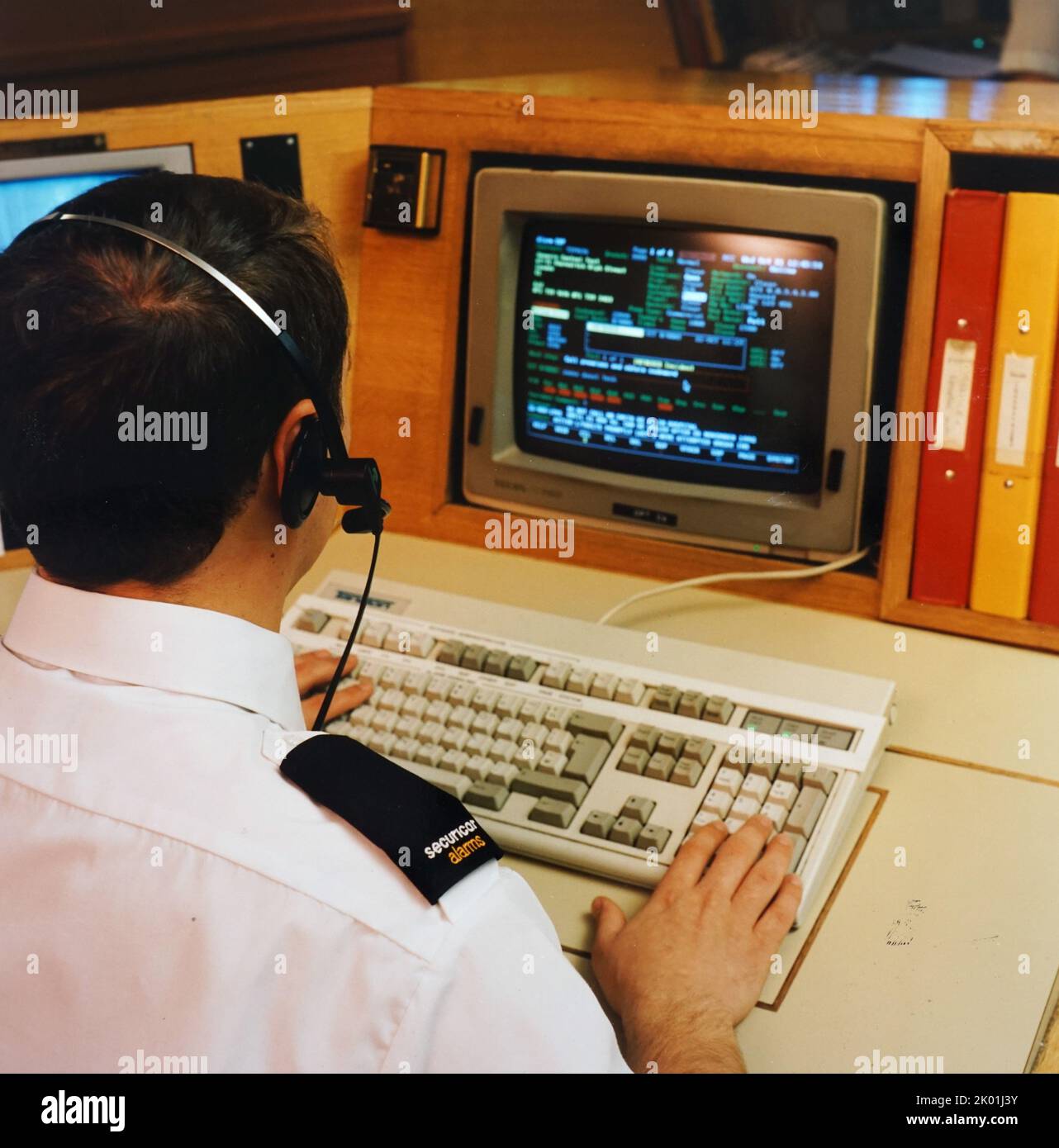 This Securicor control room monitors 27,000 alarm systems throughout Britain 24 hours a day. Stock Photo