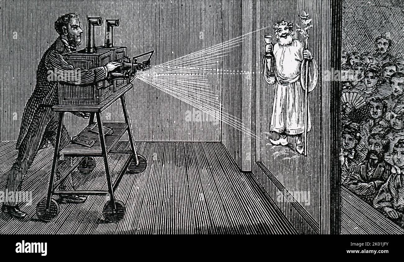 A magic lantern show. The lanterns used differ little from Kircher's in the 17th century, consisting of box with lamp placed at focus of concave mirror. Reflected light falls on condensing lens which concentrates it on a slide. Here two lanterns are being used to give dissolving views. The apparatus is mounted on a wheeled trolley, so that the operator behind the screen can alter the size of the image seen by the audience. From A Ganot Natural Philosophy, London, 1887. Stock Photo