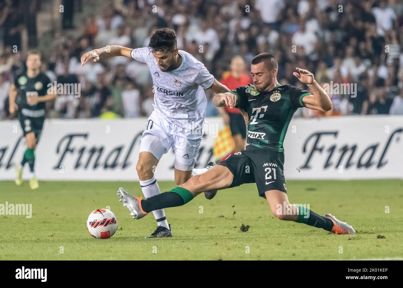 Baku, Azerbaijan – August 3, 2022. Ferencvaros right-back Endre Botka against Qarabag winger Abdellah Zoubir during UEFA Champions League qualificatio Stock Photo