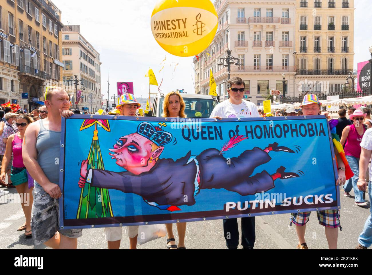 Marseille, France, Crowd Marching in LGBTQI Pride March, holding Anti-Putin Protest Banner, Homophobia on Street Slogan 'Putin Sucks' Stock Photo