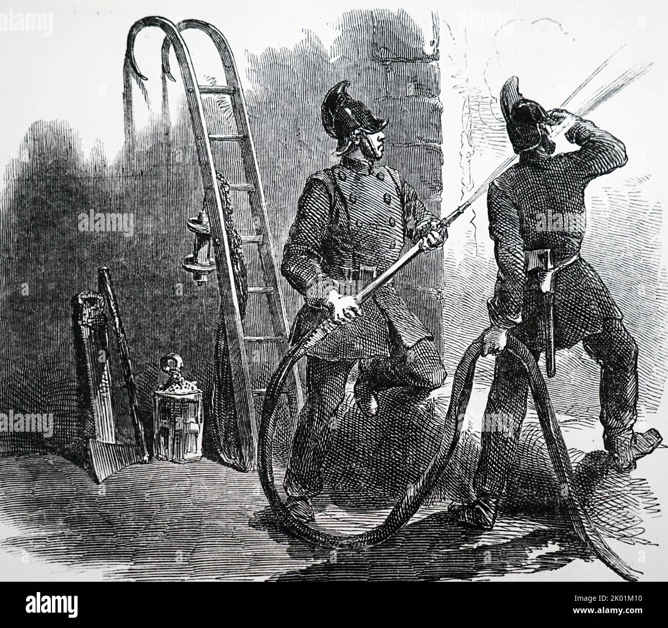 Members of the London Fire Brigade fighting a fire at the Olympic Theatre off The Strand. Stock Photo