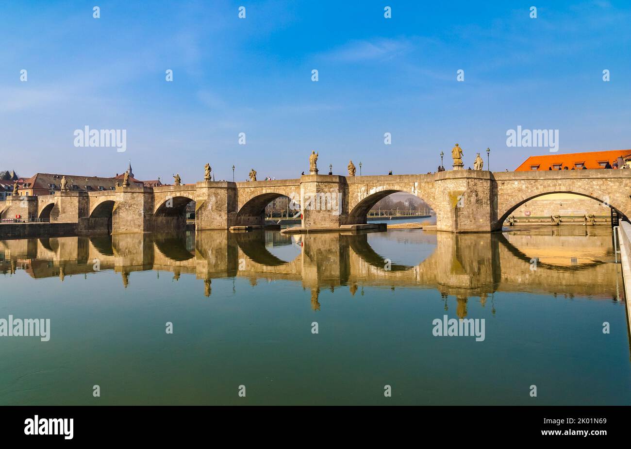 Beautiful view of the old bridge “Alte Mainbrücke” in Würzburg, Germany. The pedestrianized bridge over the Main river was erected from 1473 to 1543. Stock Photo