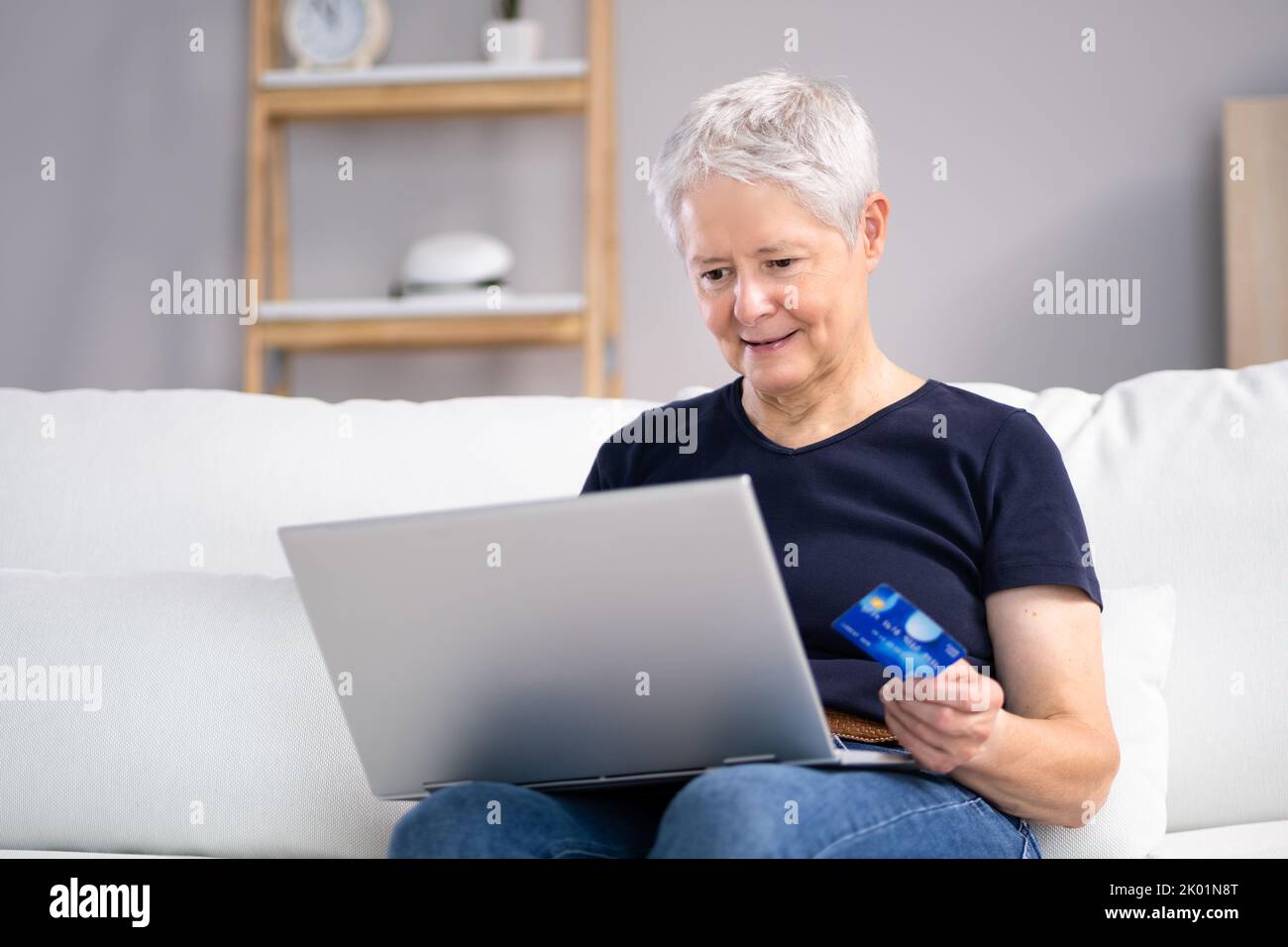 Online Shopping Using Card Credit On Laptop Stock Photo