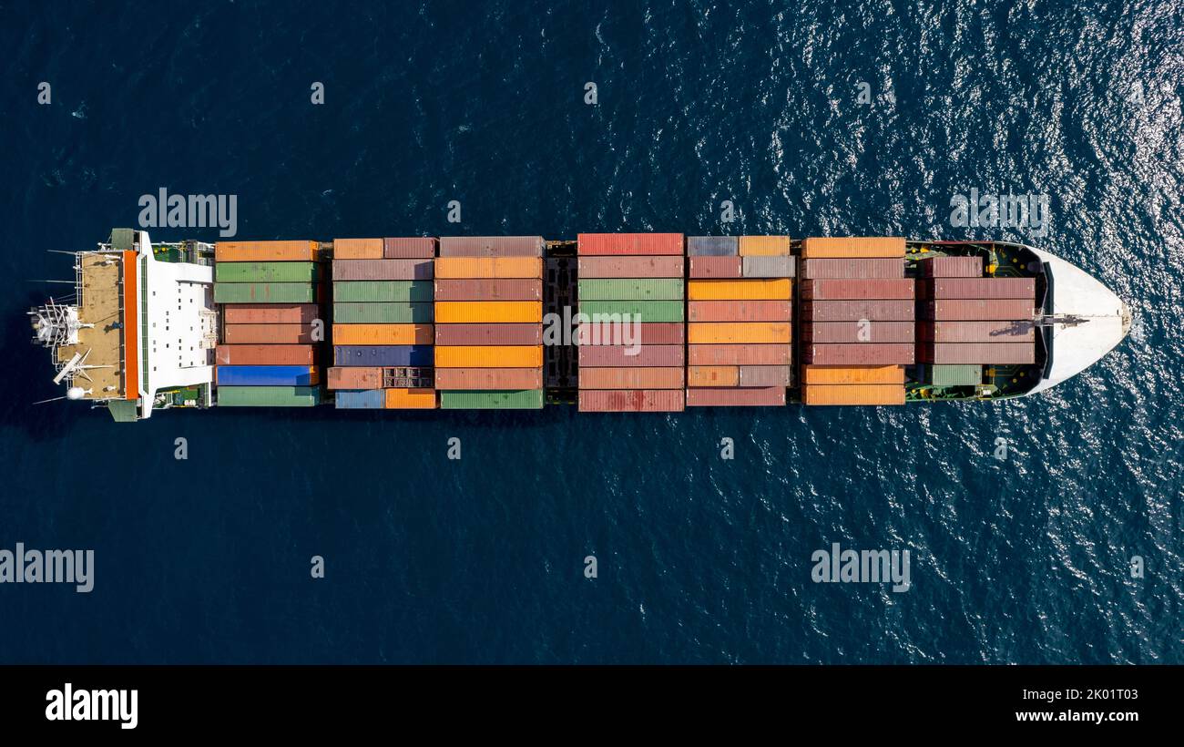 Aerial top view of a cargo ship carrying containers for export cargo. Stock Photo