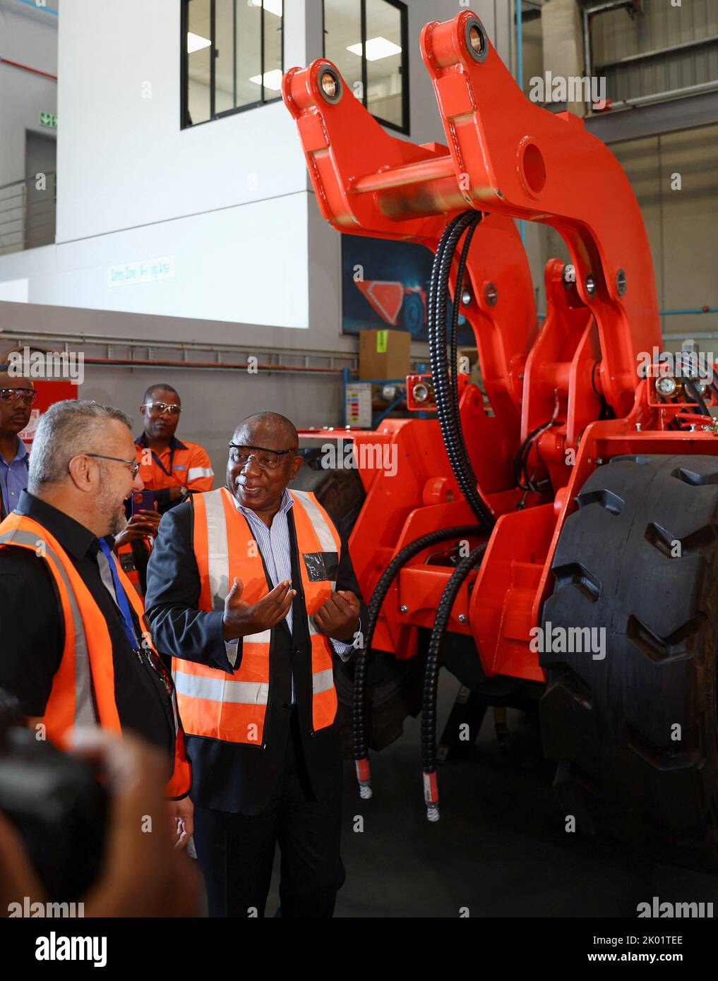South Africa's President Cyril Ramaphosa chats in front of a mining truck during the launch of the new Sandvik Khomanani manufacturing site, at Khomanani, in Kempton Park, Johannesburg, South Africa September 9, 2022. REUTERS/Siphiwe Sibeko Stock Photo