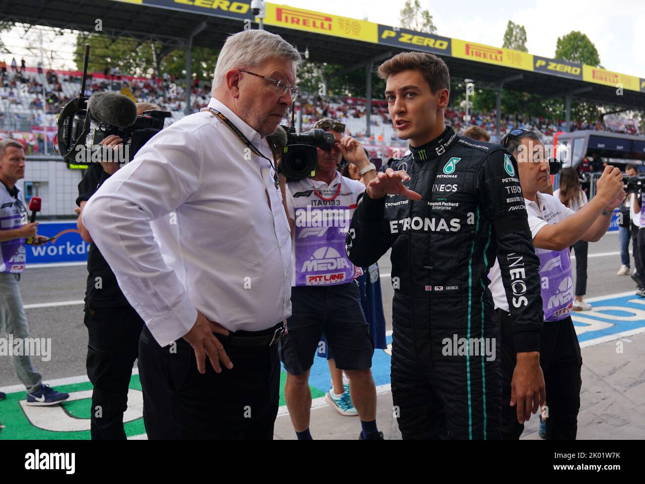 Mercedes' George Russell (left) and F1 Group managing director Ross Brawn speak after a minutes silence following the death of Queen Elizabeth II on Thursday prior to first practice at the Italian Grand Prix, Monza. Picture date: Friday September 9, 2022. Stock Photo