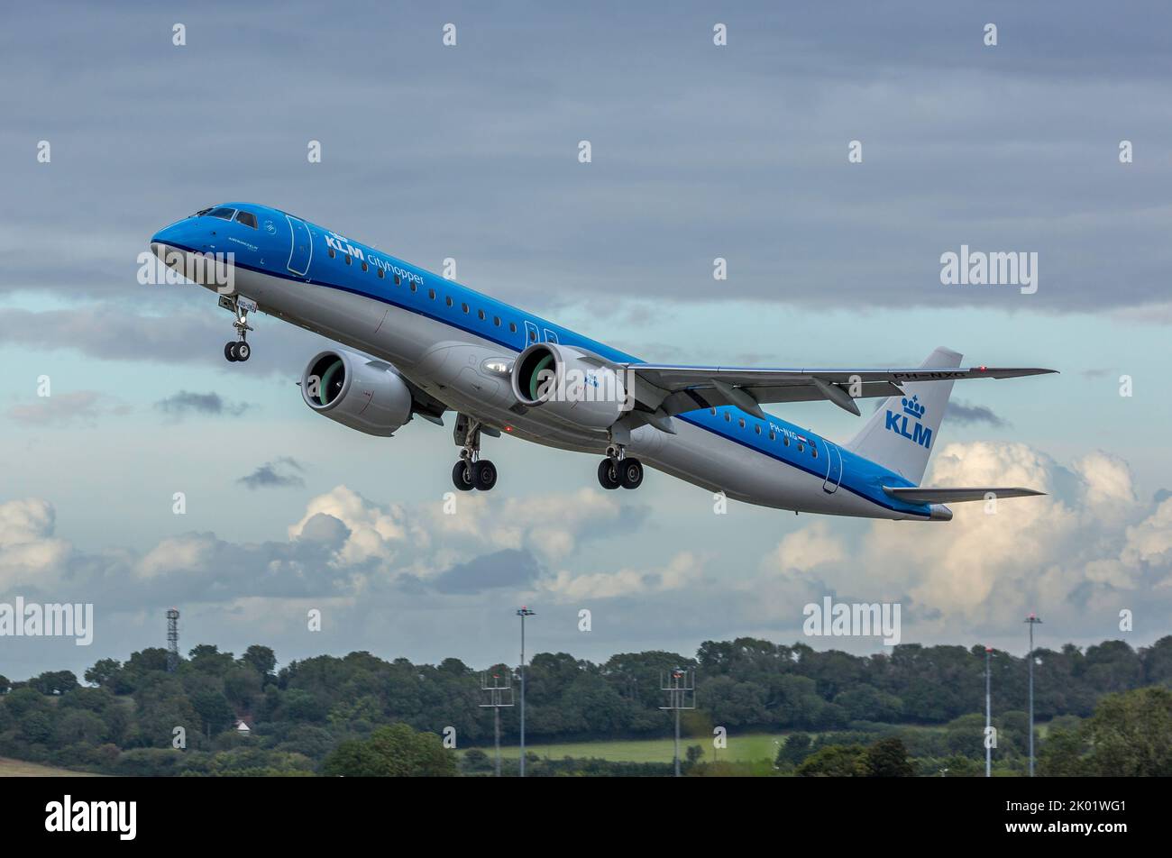 A KLM CityHopper Embraer ERJ-195 Airliner, serial number PH-NXG,  taking off from Bristol Lulsgate Airport in England. Stock Photo