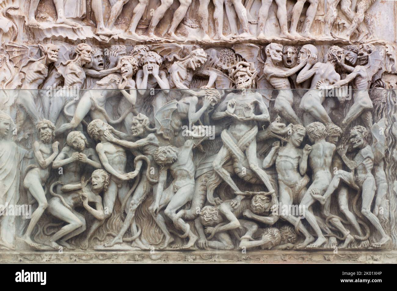 Last Judgement, Apocalypse (by Lorenzo Maitani, 14th century) - detail - Bas-relief from the 4th pillar - Facade of Orvieto cathedral - Umbria - Italy Stock Photo