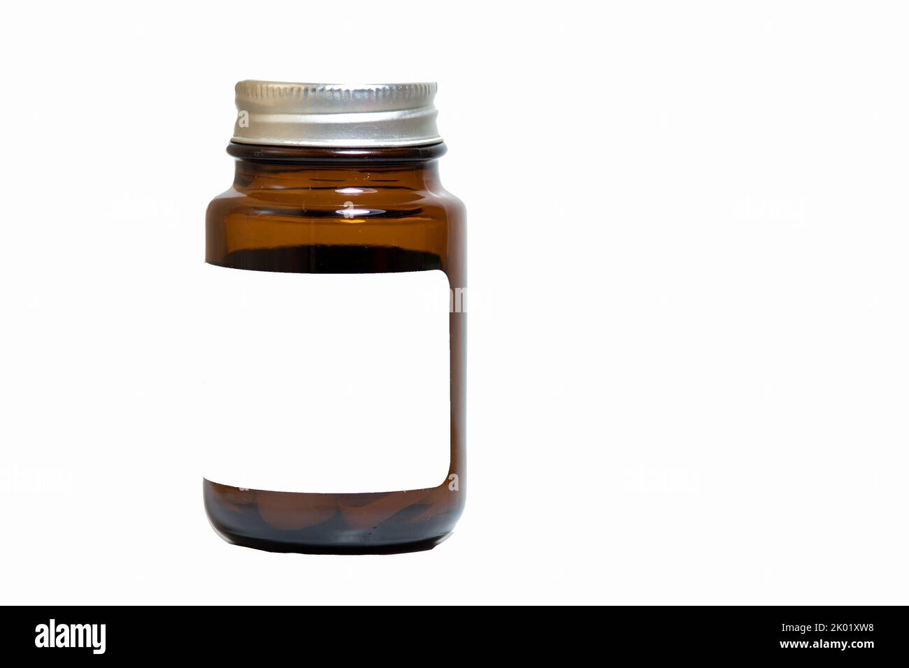 Brown color medicine bottle. Medicine bottle with white text space on it. Blank label. Treatment idea concept. No people, nobody. Stock Photo