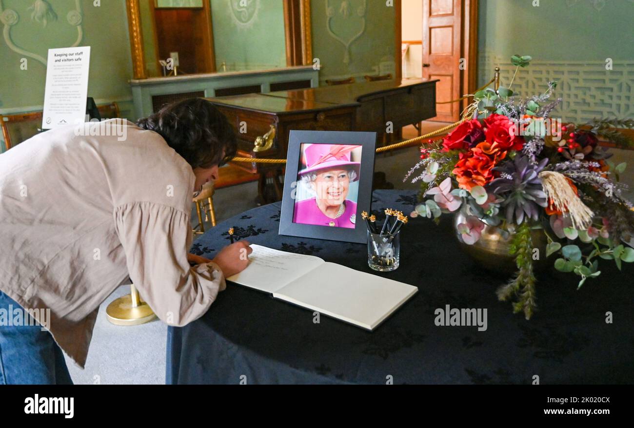 Brighton UK 9th September 2022 - A book of Condolence for the Queen is signed at The Royal Pavilion in Brighton today after her death at the age of 96 was announced yesterday . Elizabeth II reigned as British monarch for 70 years    : Credit Simon Dack / Alamy Live News Stock Photo