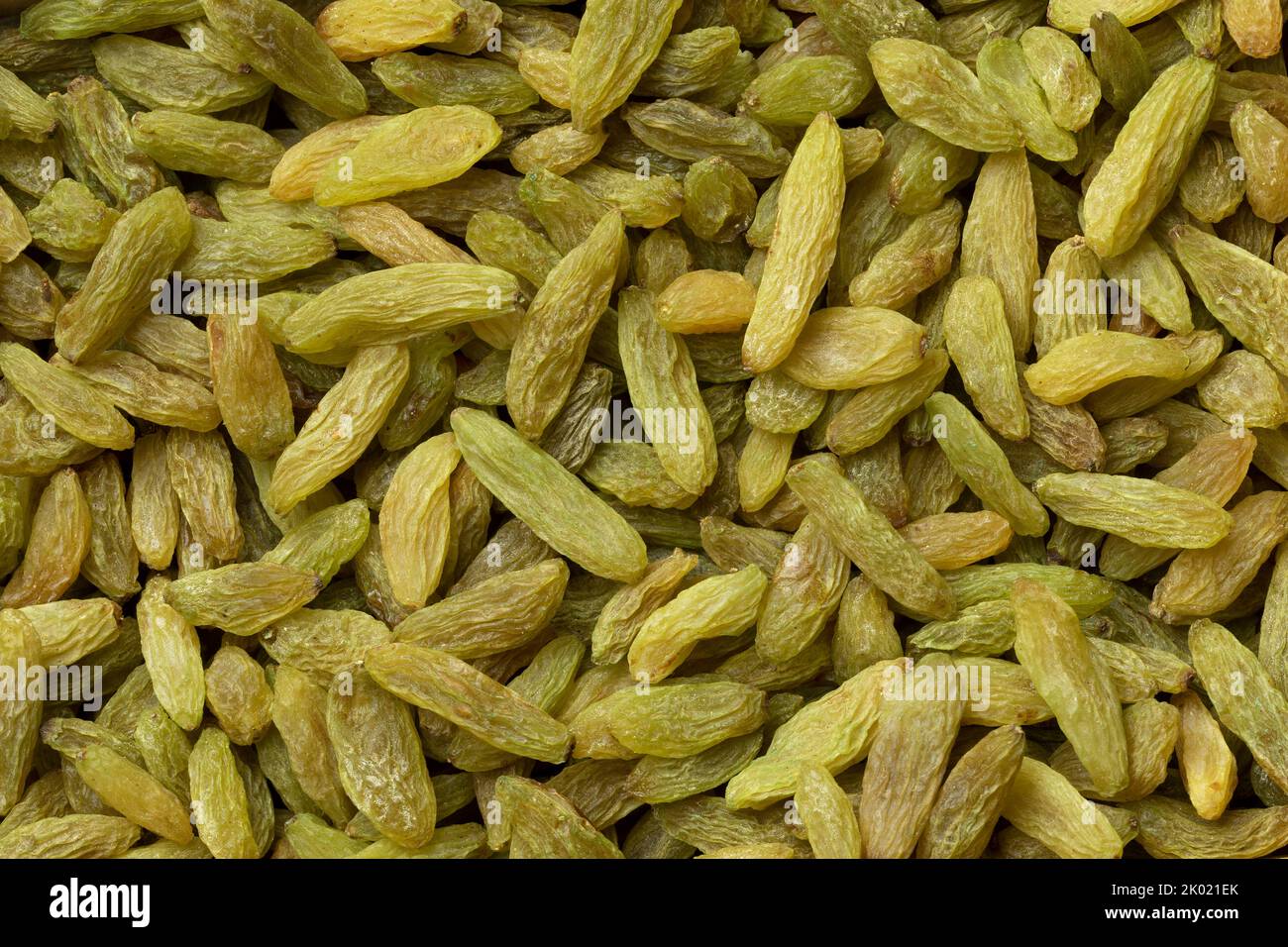 Sweet dried green sweet Afghans raisins full frame close up as background Stock Photo
